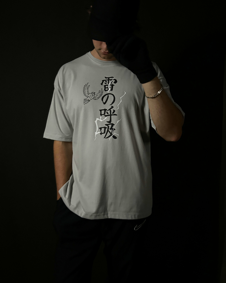 Anime-inspired apparel featuring bold back artwork, worn by a model in a dark studio setting – from a South African anime clothing brand.
