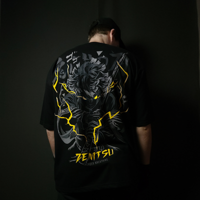 Anime-inspired apparel featuring bold back artwork, worn by a model in a dark studio setting – from a South African anime clothing brand.