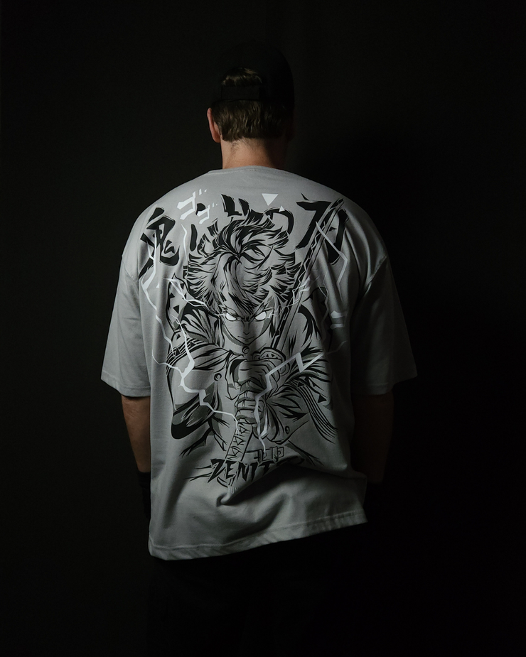 Anime-inspired apparel featuring bold back artwork, worn by a model in a dark studio setting – from a South African anime clothing brand.