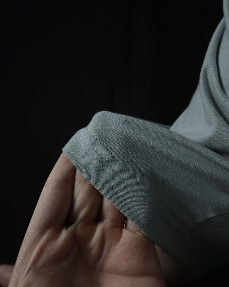 Anime-inspired apparel featuring bold back artwork, worn by a model in a dark studio setting – from a South African anime clothing brand.