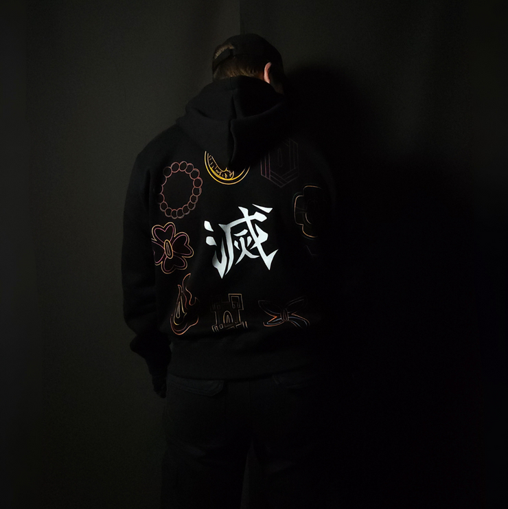 Anime-inspired apparel featuring bold back artwork, worn by a model in a dark studio setting – from a South African anime clothing brand.