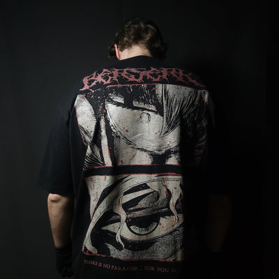 Anime-inspired apparel featuring bold back artwork, worn by a model in a dark studio setting – from a South African anime clothing brand.