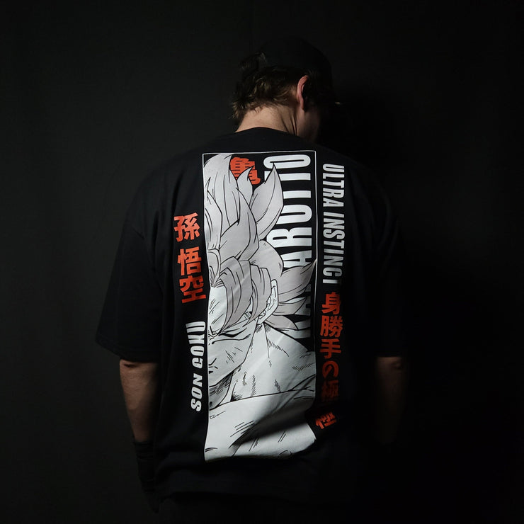 Anime-inspired apparel featuring bold back artwork, worn by a model in a dark studio setting – from a South African anime clothing brand.