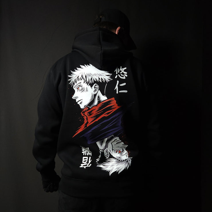 Anime-inspired apparel featuring bold back artwork, worn by a model in a dark studio setting – from a South African anime clothing brand.