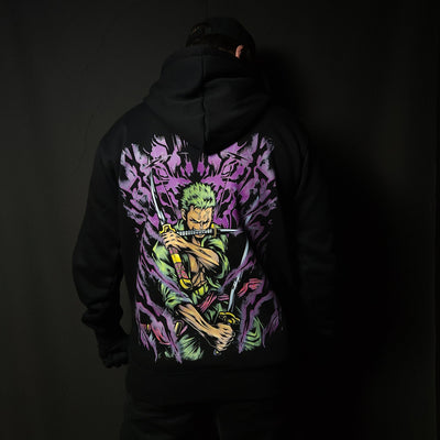 Anime-inspired apparel featuring bold back artwork, worn by a model in a dark studio setting – from a South African anime clothing brand.