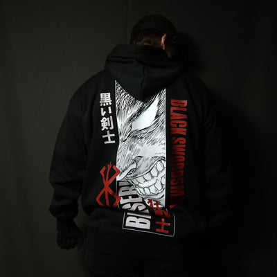 Anime-inspired apparel featuring bold back artwork, worn by a model in a dark studio setting – from a South African anime clothing brand.