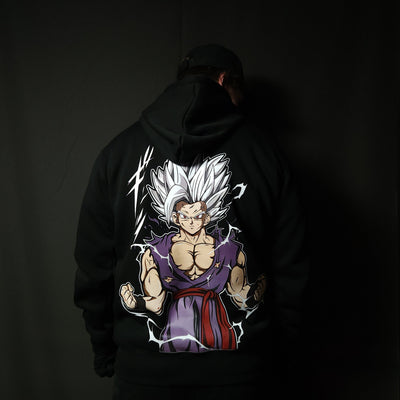 Anime-inspired apparel featuring bold back artwork, worn by a model in a dark studio setting – from a South African anime clothing brand.