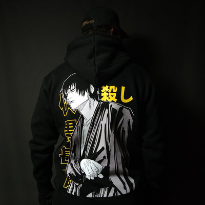 Anime-inspired apparel featuring bold back artwork, worn by a model in a dark studio setting – from a South African anime clothing brand.