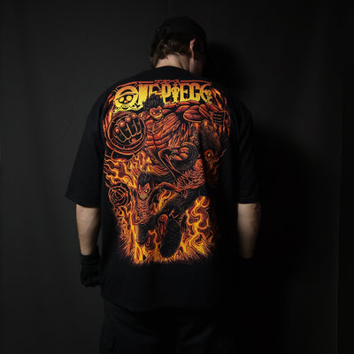Anime-inspired apparel featuring bold back artwork, worn by a model in a dark studio setting – from a South African anime clothing brand.