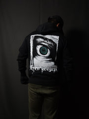 Anime-inspired apparel featuring bold back artwork, worn by a model in a dark studio setting – from a South African anime clothing brand.