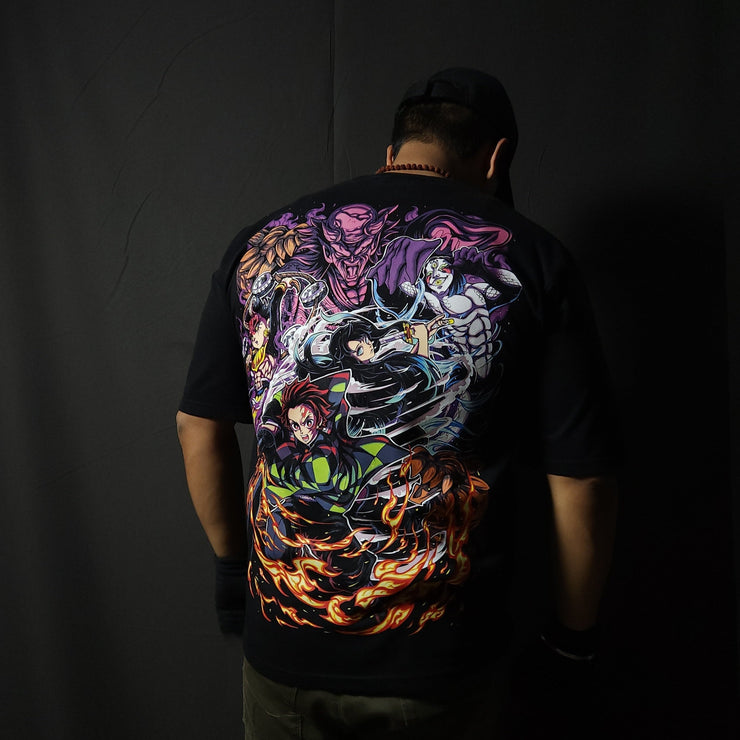 Anime-inspired apparel featuring bold back artwork, worn by a model in a dark studio setting – from a South African anime clothing brand.